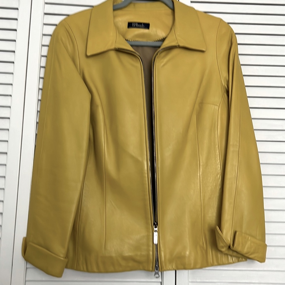 Leather classy semi fitted leather jacket with cuffed sleeves.